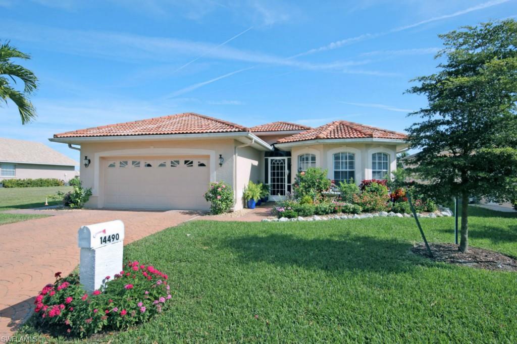 -Exquisite 3 bedroom 2 bathroom residence located in the desirable Iona Area. The entire property around this ground level home has been flawlessly landscaped with beautiful gardens, brick patio leading to a private dock. The home itself is stunning with an expansive lake/canal view.  Great windows providing remarkable natural light, open floor plan, elevated ceilings and spacious living and kitchen area. Master bedroom with French doors leading to bricked enclosed Florida room. Roomy master bath with large shower, garden tub and double sink vanity. New updates include electric hurricane shutters, plantation shutters, elevated commodes, french doors, appliances, brick patio, steps to dock & paint. Interior laundry room and 2 car garage. Boating River access from home via forklift. Waters Edge Estates is a gated community within Peppertree Pointe providing manicured grounds, marina, fishing pier, riverside beach, picnic area, jogging path, boat slips, boat ramp, community pool & tennis.