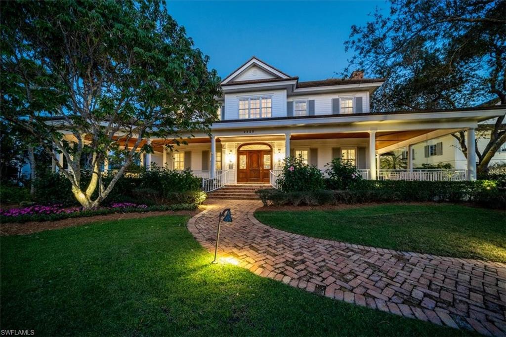 Walking distance to 3rd Street South, Port Royal Club, and beach access, this Port Royal Southern Classic with coastal charm is move in ready with a rare 2bed/2bath guest house. Architectural design was a collaboration by architects David Humphrey, Jon Kukk, Matt Joyner, and constructed by Frontier Custom Homes. The large lot and a half offers a sweeping wraparound front porch that faces west showcasing the finest sunsets and included in the 3,000 sq ft of covered outdoor lanais with reclaimed 19th century Old Chicago Brick under foot that overlook the glimmering waters of Lantern Lake and swaying palms that create a backyard oasis. Meticulously maintained with extensive upgrades in recent years. The gourmet kitchen has been re crafted by Ruffino Cabinetry with one inch thick cabinetry, Wolf, Subzero, and Viking appliances, with two wine refrigerators and entertaining bar. Two renovated primary suites evoke today's modern designs. Solid American Cherry wood flooring, front door, and custom onsite millwork throughout capture the charm of this stately home. Newer pool offers an expanse of beautiful shell stone decking to soak up the sun. New 32kw Generator. Club Membership Eligible.