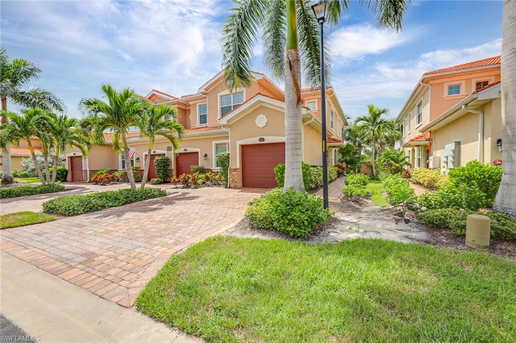 Within the gates of Sorrento, this inviting end-unit offers a western rear exposure that receives an abundance of natural light throughout the day. With three bedrooms and a den, this home is nicely appointed with 42-inch solid wood upper cabinets, stainless steel appliances, tile backsplash in kitchen, walk-in pantry, granite countertops throughout, impact windows and slider and plenty of storage space in attached garage. The one-car garage with a wider driveway for multiple cars is an added bonus. There is plenty to keep you active from the resort-style pool, exercise room and bocce court. Only minutes from Interstate 75, beaches and dining and within proximity to the airport. See all that is offered in this hidden treasure.