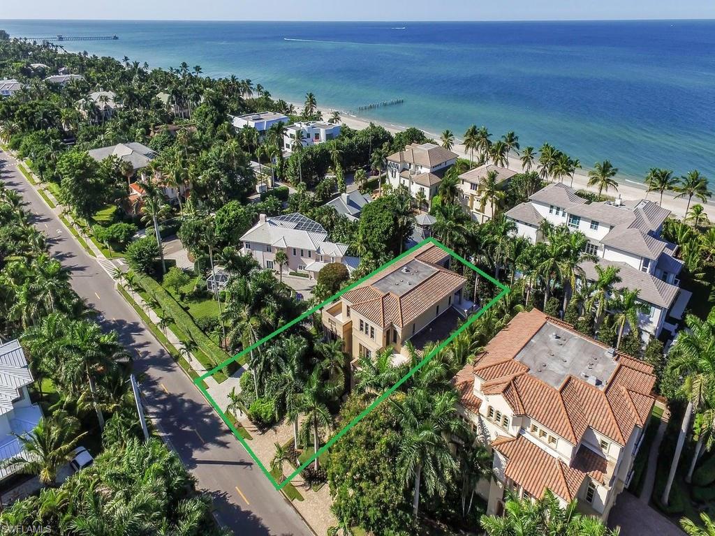 H.11210 Gorgeous multi-story home is just STEPS TO THE BEACH!  This 4 bedroom, 5 and half bath home features, a grand entry with winding staircase, private elevator, wine cellar, Deana Reale Italian Marble and Dark Walnut Acacia Hardwood floors, 6 car collectors garage, crystal light fixtures, custom textured wall, home automation, huge air conditioned storage room, and impressive Marine Reef Aquarium! The master suite consists of a breathtaking walk-in closet as well as his and hers bathrooms with huge multi-body jet walk-in shower.  Residence is completed with chef's kitchen with 4 ovens, expansive outdoor living space with partial gulf views, multiple balconies, large pool/spa and high-end finishes throughout.