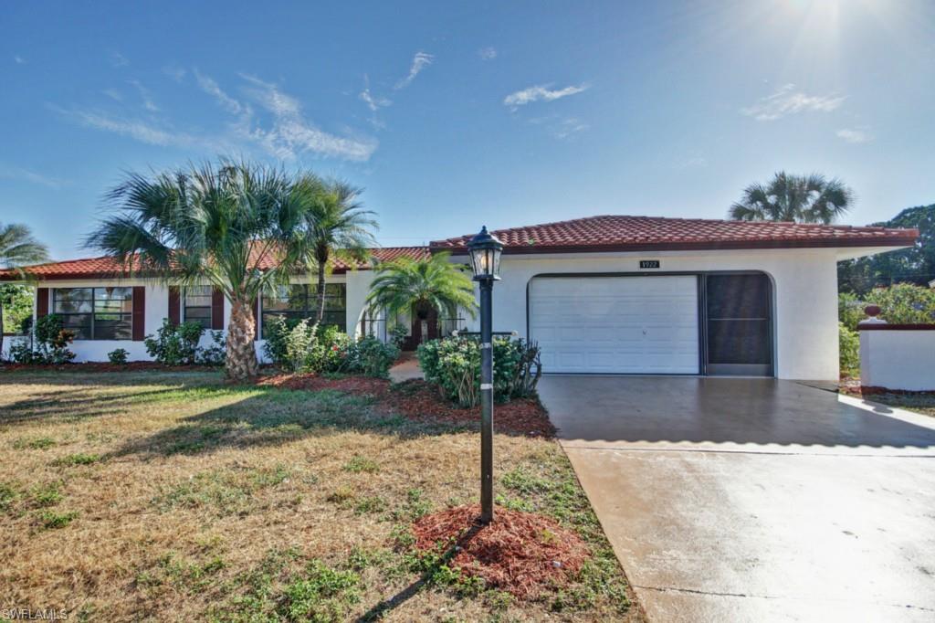As good as buying new!  Don't miss this expansive 2,204 sq foot pool home has been fully renovated and brought back to its original beauty. Situated in the highly desirable Country Club Estates (walking distance to Admiral Golf Club and Resort-- perfect for golfers), this ideal family home boasts an open floor plan with large bedrooms complemented with a open den for entertaining. Upgraded countertops and fully updated kitchen with stainless steel appliances. Each bathroom has also been updated with upgraded countertops to provide consistency in this fully thorough renovation. The shutter and awning system was replaced in 2007.The exterior has been freshly landscaped and the tile roof provides for a look that will make you the envy of the neighborhood. The property location itself is centrally located within the sweet spot of Lehigh Acres close to downtown with easy access to Fort Myers and Alva. THIS IS THE LOWEST PRICED POOL HOME IN COUNTRY CLUB ESTATES. Don't miss this one! Call your agent today and schedule a showing