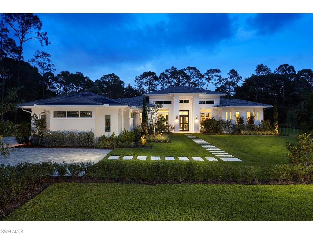 Modern Masterpiece, in the highly sought after community of Pine Ridge Estates This contemporary home is situated on 1.65 acres of pristinely manicured land. This home features a great room concept, 4
bedrooms with en-suites and walk-in closets, bonus room, in-home office, 2 linear fireplaces, wine room with unique wine wall, carrying through to the dining room, bright and airy gourmet kitchen with top of the line
appliances, quartz countertops, large island with galley sink, walk-in pantry, custom cabinetry. impact glass. Control 4 Smart-Home Technology, and is fully fenced and gated The expansive lanai offers an
abundance of entertaining space, outdoor kitchen, linear fireplace, outdoor fire-pit. electric roll down screens, pool bath, and beautifully designed custom pool and spa with fire bowls. This home is located in the
heart of North Naples. and is close to Mercato, Waterside Shops, dining, entertainment and the gorgeous white sand beaches that have made Naples one of the most sought after destinations in the world.