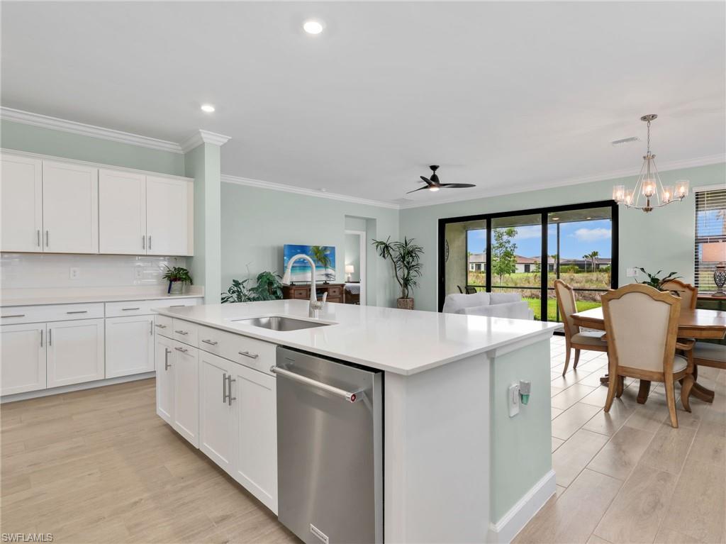 WHY WAIT TO BUILD OR DEAL WITH CONSTRUCTION MESS when you can own this beautifully upgraded and highly sought-after MARSALA floorplan in the COMPLETED WEST VILLAGE section of Verdana Village! With 3 bedrooms plus an enclosed den/flex space and 3 full baths, there is plenty of space! Known for its unique kitchen design with EXTRA CABINETRY and exceptional storage, the Marsala is one of the community’s most popular floorplans, and this one stands out from the rest. Enjoy peaceful EASTERN PERSERVE sunrise views and a quiet location while living in a home loaded with premium upgrades including a whole home GENERATOR, impact windows and doors, decorative hurricane impact glass front door, rare CROWN MOLDING, tile backsplash, premium EPOXY GARAGE floor, TANKLESS water heater, and tile flooring throughout. The open-concept layout is ideal for entertaining and everyday living with beautiful natural light, plus plenty of room for a custom pool! Ask about pool package bundles! Verdana Village features one of Southwest Florida’s most impressive resort amenity experiences featuring outdoor AND INDOOR PICKLEBALL and tennis courts, multiple resort-style pools, expansive fitness centers, bocce courts, dog park, covered playground, indoor basketball, and on-site dining with THREE RESTAURANTS and bars. Everyday convenience is right at your doorstep with the newly opened shopping center adjacent to the community featuring Publix, Dunkin’, UPS Store, hair and nail salons, physical therapy, dental services, upscale Italian dining, bank, and additional businesses still on the way - like a recently announced Lee Health URGENT CARE coming soon! Hop in your golf cart and run your errands with ease! This prime Estero location is also close to Old Corkscrew and Stoneybrook Golf Clubs, Miromar Outlets, Gulf Coast Town Center, and just a short drive to Southwest Florida International Airport. This is the Florida lifestyle buyers have been waiting for!