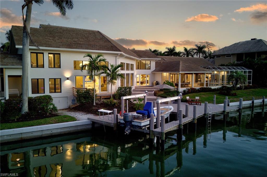 Absolutely one-of-a-kind Estates area home on two lots with over an acre of land and 277 feet of waterfrontage. Boasting 30' ceilings in great room with over 8,300 square feet under air. 7 bedroom en suites and 8 baths. Entertaining at its finest with billiards area and bar, huge dining room and huge kitchen with room to seat 20. Extensive renovations in 2019-2020 to include new seawall, impact-resistant doors and windows, new roof, new kitchen. 2 primary suites. Downstairs primary complete with two baths and two walk-in closets. This compound is complete with a tennis court and basketball area. 2 separate entrances with two separate garages and, total of 5 parking spaces. Huge lanai with pool and spa area, large walk-out deck for entertaining, grilling or sunning. This incredible family home comes completely turnkey furnished! Don't miss this incredible rare to find water-direct family home, minutes to open Gulf waters. Enjoy the Marco Island lifestyle you deserve!