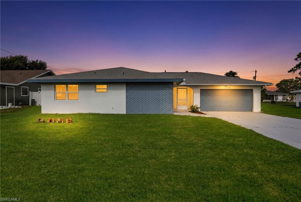 Welcome to this beautifully updated 3-bedroom, 2-bath home offering 1,321 square feet of comfortable living in desirable Southeast Cape Coral. From the moment you arrive, you'll appreciate the fresh exterior paint, well-maintained landscaping, and freshly painted driveway, creating excellent curb appeal. A new roof installed in 2023 provides added peace of mind.

Inside, the bright and open floor plan is filled with natural light and features luxury vinyl plank flooring throughout. The thoughtfully renovated kitchen is designed for both everyday living and entertaining, showcasing black stainless steel appliances, solid wood cabinetry, granite countertops, and a convenient breakfast bar that opens to the main living and dining areas.

Large windows and sliding glass doors bring the outdoors in, overlooking the spacious screened lanai and private backyard—an ideal setting for relaxing or hosting family and friends. The primary suite offers a peaceful retreat with an updated en-suite bathroom featuring dual marble-top vanities and a beautifully tiled walk-in shower.

Conveniently located in Southeast Cape Coral, this move-in-ready home combines modern updates, functional living spaces, and an inviting atmosphere you'll be proud to call home.