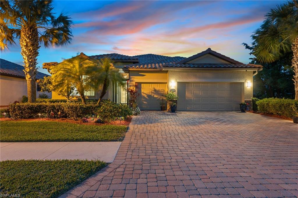 Imagine enjoying sunsets each day overlooking the gorgeous lake from your expansive lanai with beautiful heated pool and spa. This 4 BR, 3 BA, beautifully decorated home with rarely available 3-car garage is located in the popular Copper Cove community, known for reasonable fees and a great location convenient to Old Naples & Marco Island. This open-concept residence is immaculately maintained and offers a spacious great room and kitchen, dramatic foyer entry with glass door and screen, large tile floors set on a diagonal, crown molding, decorative chair rail, garage storage, storm screen on lanai, large closets and lots of windows allowing extraordinary natural light and adding to the open and spacious feel of the home. The impressive open kitchen has granite counters, stainless appliances, induction stove, island, breakfast bar, upgraded cabinetry, ample counter space and lovely breakfast nook. Laundry room with storage cabinets and front-load washer and dryer. Plenty of privacy for guests and family members. This layout of this home is excellent for entertaining and perfect indoor-outdoor living with very nice covered and uncovered areas of the lanai for shady or sunny options.