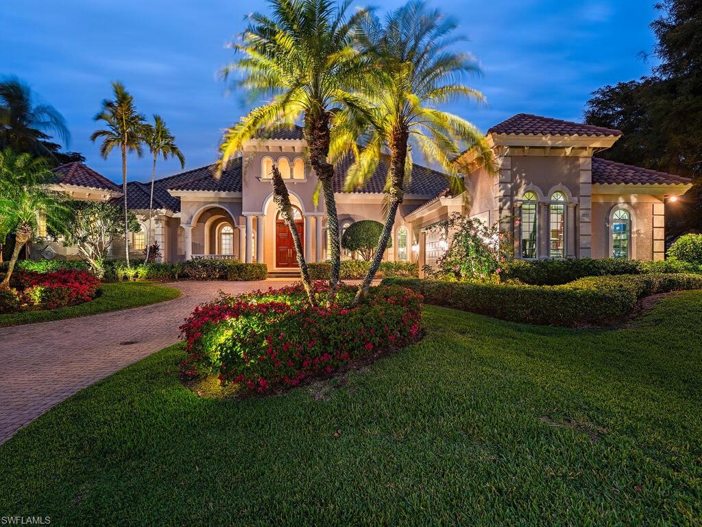 Welcome to Resort Style Living, Welcome to Grey Oaks! IMMEDIATE GOLF MEMBERSHIP AVAILABLE. This luxurious estate home features stunning water and golf course views of the 16th fairway of the Palm Course. This one-level residence is a perfect blend of sophistication, elegance, and privacy. Designed to facilitate seamless indoor and outdoor living, this exquisite home features a primary bedroom suite with sitting area and large doors that open to the lanai. The additional 3 guest bedrooms, each with their own ensuite bath are situated away from the primary wing. The large den with built-ins, offers French doors opening to the lanai. The expansive open-concept living area creates a serene backdrop for everyday living, with high-end finishes and panoramic views throughout. The gourmet kitchen is perfect for entertaining family and friends, boasting custom cabinetry, and seamless flow into the family room and dining areas. Opening with corner pocket doors, the outdoor oasis takes center stage with a large screened-in lanai, complete with a full summer kitchen and plenty of room to relax and enjoy the magnificent views.  The heated pool and spa, pool bath and outdoor shower, only adds to your own private retreat. New roof in 2017, generator and window and door coverings throughout. 3 car garage. This special home offers the perfect blend of elegance, privacy and breathtaking views! Grey Oaks Country Club is Naples' one and only private club with 54 holes of championship golf. In addition, the club offers an unparalleled array of exclusive amenities, including a newly renovated wellness center, a lagoon-style pool, tennis, pickleball, bocce, multiple dining venues, and a luxurious spa. The amenities are truly endless.