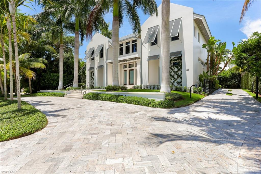 One of the best values in Old Naples!  This custom residence, which is finished at a level sure to please even the most discerning buyer, lives like a new home. Located just steps to the renowned sugar sand beaches of the Gulf of Mexico, this home has one of the most impressive outdoor spaces in Old Naples and is perfect for entertaining. The great room concept features a chef's kitchen that opens to the dining and living spaces. Highlights of the chef's kitchen include marble counters, top of the line Miele/Wolf/Subzero appliances and a walk-in pantry. In addition to the house generator, custom Downsview cabinetry, Legno Bastone wide plank flooring, glass-enclosed wine storage room, home theater, large office and study area with built-in bookshelves, exercise room and a state of the art home automation system, the home has numerous glass doors that lead to a spacious and inviting lanai and pool area, allowing the interior living spaces to blend harmoniously with exterior spaces and the surrounding lush vegetation. This home lives like a sublime resort. The well-appointed separate guest cabana boasts a private entrance and sun deck. This is luxurious Old Naples living at its best!