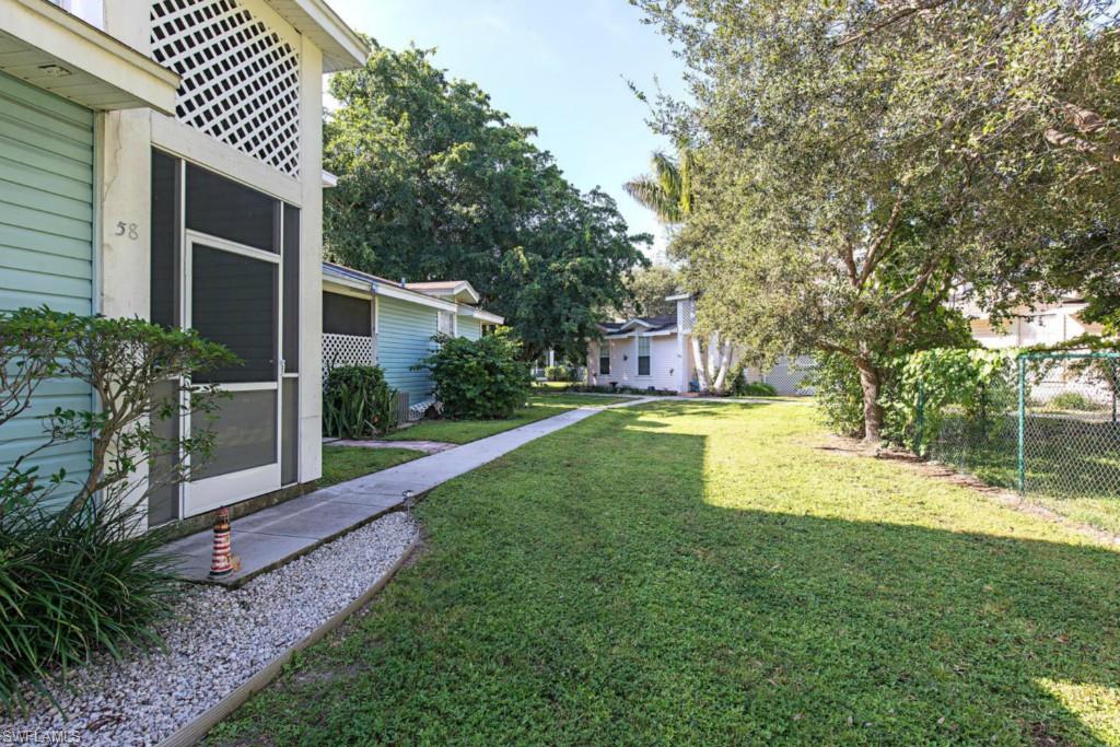 C.10603 - Nicely updated 3 bedroom, 2.5 bath 2 story condo with tile & wood floors. Master bedroom on first floor, 2 guest bedrooms and full bath upstairs. New granite counters in kitchen, beautiful quartz counters in bathrooms, polished travertine master shower walls and marble shower walls in upstairs guest bathroom.  Large screened lanai is newly tiled.  New lighting, new toilets in master and guest baths, and new water heater. Great location across from the community pool.  Quiet, peaceful and private.  *BONUS* SELLER offering to pay 6 months of association fees at closing.