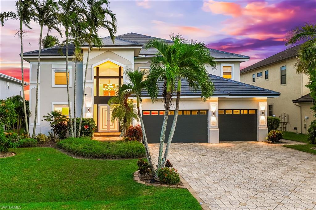 Step into timeless sophistication with this breathtaking riverfront estate, a residence that seamlessly blends modern luxury with effortless coastal living. Meticulously remodeled in 2022 and offered furnished, this home invites you to begin living the signature Florida lifestyle from the moment you arrive. Boasting 6 spacious bedrooms plus a den, 5 and a half luxurious baths, and a 4-car garage complete with an air-conditioned workshop, every inch of this property has been thoughtfully crafted to deliver elegance, comfort, and functionality. A new tile roof, impact-resistant windows and doors, and a chef’s kitchen showcasing exquisite quartz surfaces, a waterfall-edge island, and curated cabinetry elevate this home into a class of its own. The expansive great room is drenched in natural light with soaring ceilings and panoramic views of the River through walls of glass. A double-sided fireplace anchors the space, creating a warm ambiance ideal for intimate evenings or elegant gatherings. Two grand master suites offer the ultimate in privacy and indulgence—each with a screened in private balcony, spa-inspired baths, freestanding soaking tubs, and custom walk-in closets. Floor-to-ceiling windows frame uninterrupted river views, evoking the serenity of a private resort. An elevator ensures ease of access to every level, while a state-of-the-art media suite—complete with a full bar—provides the perfect venue for entertaining, movie nights, or can serve as a private guest or in-law suite. The outdoor living space redefines relaxation and recreation with a heated infinity-edge pool, spa, and multiple areas for open-air lounging and dining. For the boating enthusiast, this property is a dream come true—featuring a new 20,000 lb. boat lift and a Trex captain’s walk dock that accommodates large vessels with ease. Beyond its architectural beauty, this home also presents a remarkable investment opportunity. Operating as a high-end, income-producing Airbnb, it has hosted full weddings and exclusive events, consistently attracting luxury clientele drawn to its blend of elegance, privacy, and waterfront allure. With its captivating riverfront setting, masterful design, and unrivaled amenities, this residence embodies the pinnacle of Southwest Florida luxury living—an exquisite sanctuary offering both an extraordinary lifestyle and exceptional income potential.