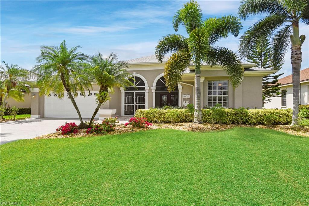 Lakefront home with tons of charm! This home offering almost 2,600sf of under air living space literally has character like no other home in Berkshire Lakes - large screened front lanai w/ French doors & pavers, arched windows, volume ceilings & recessed lighting, gorgeous high-end flooring & plantation shutters throughout, impact glass/doors, split bedroom floor plan with the guest rooms having an extra storage cabinet over the closet, lots of natural lighting, and disappearing sliders off of the living room. The kitchen has just been renovated and features a long breakfast bar, quartz countertop, double oven, wall convection microwave, designer cabinets, breakfast nook, and a large walk-in pantry. You will love spending time on the extended screened rear pool lanai that offers an under truss area, pavers on the pool deck, and a wonderful view of the lake. In 2017 a new architectural shingle roof was placed on the home. Berkshire Lakes is a non-gated, deeded community that offers a community pool, clubhouse, & exercise room w/ low HOA fees. Conveniently located next to lots of shopping and dining options and has easy access to I-75.