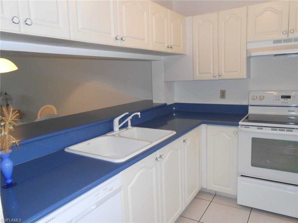 Great location near 5th Ave downtown Naples. Look no more! End unit with pool view. Good investment property with rental potential. Just installed new dishwasher and dryer. TOP FLOOR condo with newer tile floors, adorable eat in kitchen with updated cabinets and counter top. Extra Cabinets in dining room. Great for entertaining. Nice open floor plan with updated tile shower in bathrooms. Large walk in closet in Master bedroom. Balcony is tiled and over looks pool and lush landscaped area. Electric hurricane shutters on balcony and manual shutters on windows. Fantastic community with club house, community pools and docks for rent or purchase when available. Come see this well priced ready to sell garden apartment.