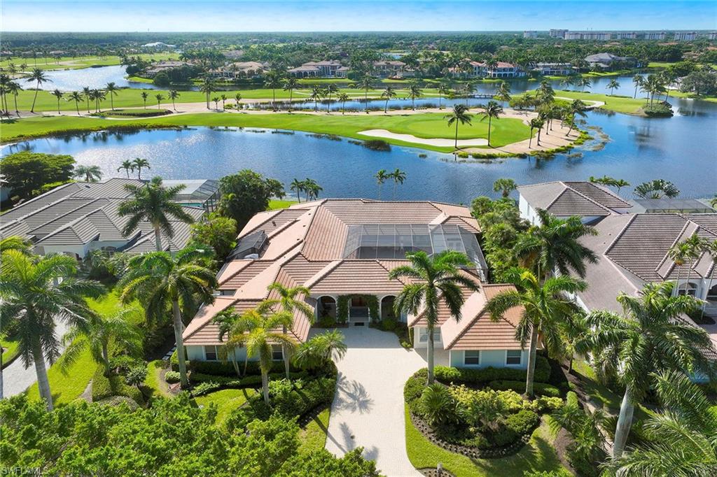 Immediate Full Golf Membership Available. This custom-built home in the exclusive Grey Oaks community combines thoughtful design with unparalleled functionality featuring a brand-new roof and a prime south-facing lake-to-golf homesite overlooking the tropical Grey Oaks Palm Course. Offering six bedrooms, six baths, two offices, and a detached cabana overlooking the pool area.  This residence is designed for those who value distinct private spaces and wonderful public gathering areas that enhance daily living.  
At the heart of this nearly 5,000-square-foot home is a stunning 2,250-square-foot interior screened-in courtyard, seamlessly connecting the living areas while providing an oasis of natural beauty and privacy.  With its large, updated pool and spa, two spacious covered living areas, and a fully equipped outdoor kitchen and bar, the courtyard is ideal for entertaining or relaxing.  The large open kitchen features an adjacent dining area butler's pantry and wet bar. The family room is bathed with natural light through French doors that lead to an adjacent patio ideal for al fresco dining. 
The owner’s suite overlooks the panoramic lake and golf course view and features dual baths and custom closets with an adjacent study completing the ideal private oasis. Additional features include a 9-by-49-foot rear screened-in covered lanai, a second office with lake and golf course views, attached three-car garage plus large workshop, detached private cabana with living room, two baths with two adjacent bedrooms and a gas generator. 
A world of luxury awaits you in Grey Oaks including three championship golf courses, lagoon resort-style pool and bar, wellness center with spa services, tennis and pickleball courts just minutes from downtown Naples.