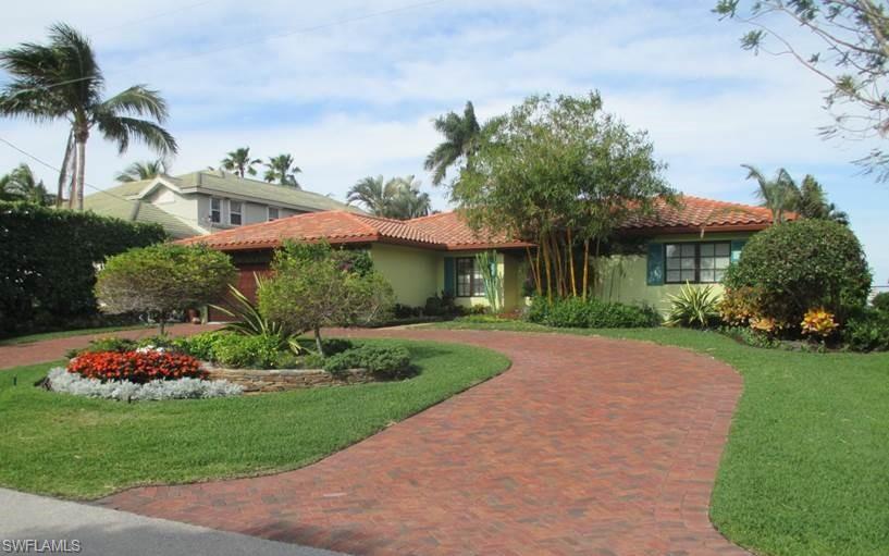 This beautifully renovated home is situated directly on Naples Bay - stunning western view - directly across from the Naples Yacht Club! Enjoy the most beautiful picturesque sunsets every night from the unobstructed water view - in the no wake zone of the bay. The interior features an open floor plan that is perfect for gathering with your guests and family. Many new features of this meticulously maintained residence include a spacious chef’s kitchen with a stunning island, open to a lovely living room and adjacent 2nd lounge area. The views from the open area and master bedroom are just fantastic - looking out onto the thrilling constant action on the bay. Custom contemporary bathrooms, tile and wood floors, with even a separate a/c in the master bedroom. Obviously with impact windows and doors throughout. The inviting large grass backyard features a pool, tiki hut and plenty of outdoor entertaining spaces. The boat & jetski docks and lifts give direct access to the bay and Gulf of Mexico. A pleasant walk to downtown Naples where you can enjoy fine dining, world class shopping and white sand beaches. This property is a perfect fit for those wanting a cozy single floor home.