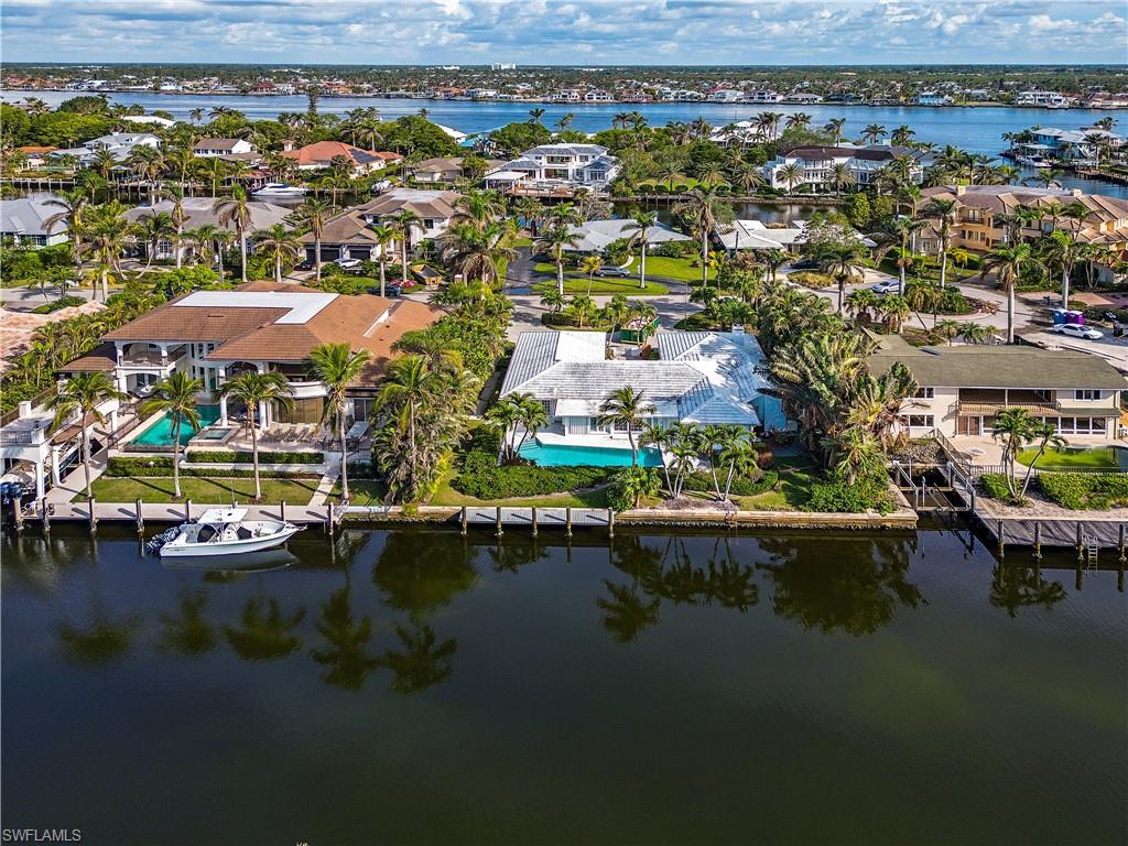 Rebuild the charming structure or build your own dream home on one of Aqualane Shores prime streets, 7th St S. Western exposure and a regular shaped lot are ideal and being just a quick stroll to the beach or golf cart ride to shopping and dining, this location has it all. Being sold in its as-is condition, the current home I light and bright and has an easy flowing floorplan with spacious master suite and expansive living areas. Aqualane Shores is a perfect location for all, being centrally located and no bridge access to the Gulf of Mexico.