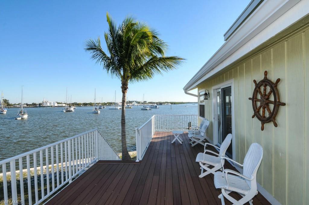 Location, Location, On Estero Bay with Wonderful Bay & Harbor Views. Close to North bridge easy on and off Island with  short walk to great restaurants and beach. 2 bedrooms 1 bath up stairs with a bonus loft. 1 Bedroom 1 bath down stairs in apartment with kitchen. All new renovation completed 1.5 years ago including completely re wired and re plumbed with  wood and tile flooring including impact glass windows and doors. All Granite and Stainless kitchens. Room for a Pool withe Bay View. YOU MUST SEE THE VIRTUAL TOUR.