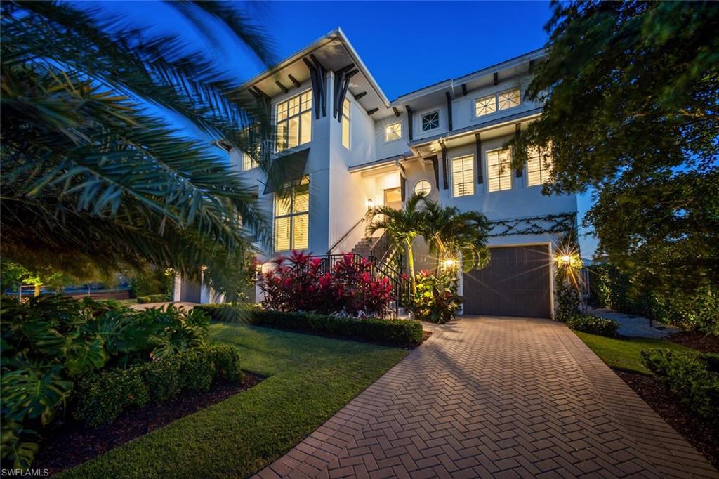 Move in today!  Completely Furnished, whole house generator, SONOS sound system throughout, Hurricane impact windows, doors, screens and shutters, solar panels to heat pool, propane tank for gas stove and grill, elevator, covered dock with electric and water, 13,000 lb boat lift, 5,000 lb jet ski lift and more. Absolutely Stunning southern facing interior designer’s personal home with Gulf access in highly desirable waterfront neighborhood. A fresh take on Naples living, this estate home exudes elegance and style inside and out.  Open architectural concept designed by MHK boasting 3 levels (elevator servicing each), 4 en-suite bedrooms plus a den that can serve as a 5th. An incredible gym, social spaces on all three levels and 7 bathrooms, this house will wow the most discerning buyer.  Chef’s dream kitchen featuring Thermador professional appliance package and 2 dishwashers. Thoughtful features include 2 laundry rooms, an outdoor kitchen in a generous lanai, remote operated roll screen and hurricane shutters. The Master suite is conveniently located on the main living level. Enjoy life on the water with a gorgeous dock and covered boat lift and a separate lift for jet skis or kayaks. Or just lounge by the pool with a large spa and relaxing sun shelf.  All of this just minutes by foot to the white sands of Vanderbilt beach and a short boat ride to the beautiful Gulf of Mexico for those amazing southwest Florida sunsets. This home is conveniently located near many dining and shopping options at Mercato and Waterside Shops.