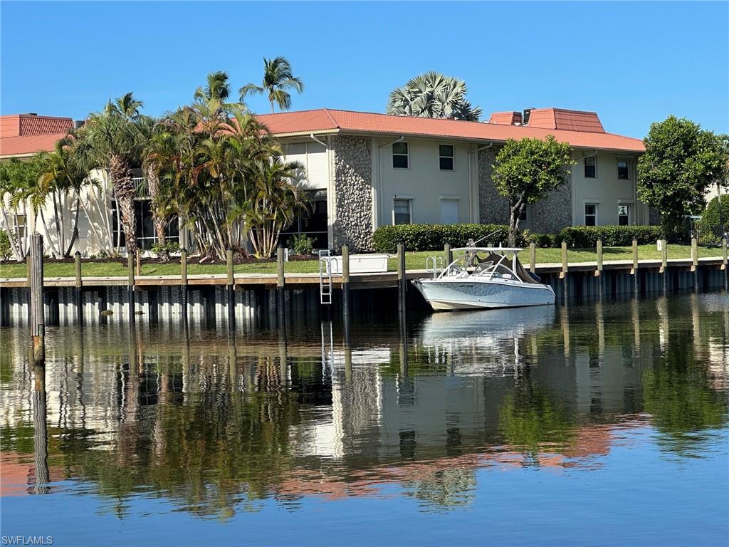 Strategically located end-unit waterfront condo with extra windows, canal views, and an incredible boating setup in Naples. This charming first-floor 2-bedroom, 2-bath residence includes a brand-new deeded 30-foot boat dock with electric and water, plus a new wooden dock and seawall. Enjoy direct Gulf access with no bridges through Naples Bay, making this a rare opportunity at this price point.

Inside, the condo features fresh paint, granite countertops, stainless steel appliances, and inviting living space with peaceful views of the canal and boat dock. The end-unit location adds extra natural light and a more open feel. The residence is comfortable as-is while also offering the opportunity to personalize and update over time to create your ideal Naples waterfront retreat.

Cherrystone Court is a 55+ community offering a community pool and BBQ/grill area in a relaxed waterfront setting. Ideally located near Royal Harbor, Naples Bay, Tin City, Bayfront, 5th Avenue, 3rd Street, dining, shopping, beaches, and all the best of the Naples lifestyle. Whether used as a permanent residence, seasonal escape, or investment opportunity, this is a rare chance to own a waterfront condo with a private deeded dock and no-bridge Gulf access in one of Naples’ most desirable boating locations.