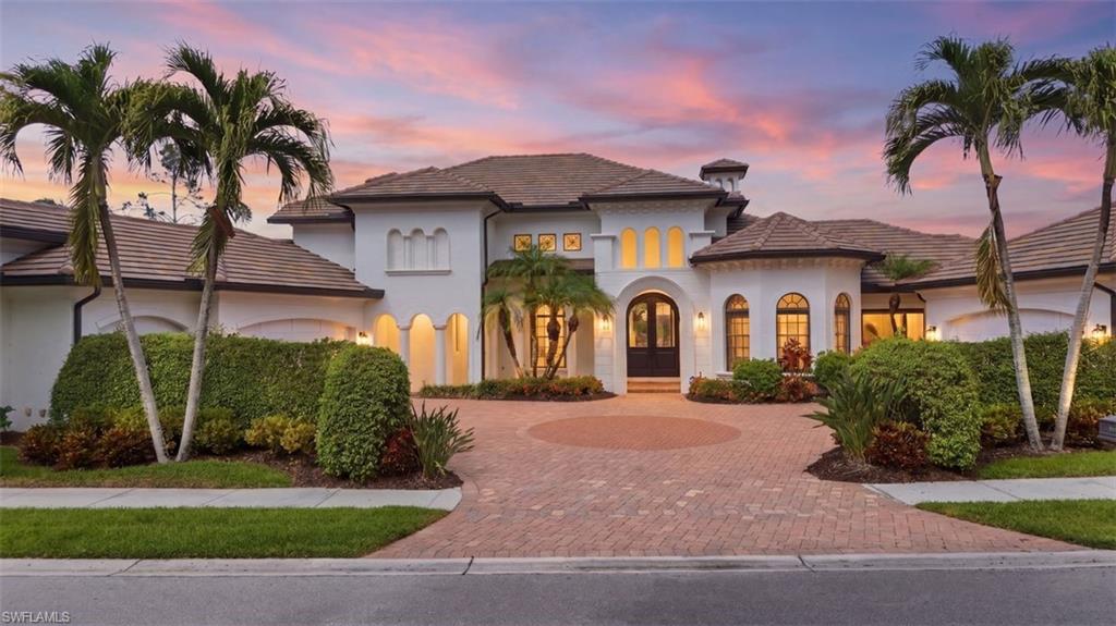 One or more photo(s) has been virtually staged, AI generated or rendered.  Welcome to an amazing opportunity in Da Vinci Estates at Olde Cypress—an exclusive DOUBLE-GATED community known for estate-sized homes and unparalleled privacy. This property has LAKE VIEWS, a RARE FIVE-CAR GARAGE and a GUEST HOUSE. Major 2025 upgrades include: NEW ROOF, GUTTERS, FULL EXTERIOR PAINT, AND HVAC. Designed for both luxury living and entertaining, the home features a chef’s kitchen with a Viking gas range, Bosch dishwasher and Fisher & Paykel double oven. Expansive pocketing sliding glass doors seamlessly retract into the walls, creating a complete indoor-outdoor living experience that leads to the HEATED POOL and GROTTO SPA. The main floor features a full East-Wing primary suite that has a cocktail/coffee bar, double vanities, free-standing bathtub, private shower room, oversized walk-in closet, and a sitting room that leads to a PRIVATE GARAGE ENTRY. The main floor also features an office, 2 living rooms, formal dining, laundry room, half bathroom, gourmet kitchen and 2 bedrooms with a jack & jill bathroom. The second-floor entertainment level has a MOVIE THEATER AND BILLIARDS ROOM with a half bath. The seperate guest house or in-law suite is 1 bed/1 bath with a wet bar and has beautiful lake views with sliding doors leading to the pool area. Located in a premier North Naples golf community with a P.B. Dye championship course, FULL and ASSOCIATE GOLF MEMBERSHIPS AVAILABLE, and a newly completed $17M CLUBHOUSE TRANSFORMATION (NO ASSESSMENTS & NO FOOD/BEVERAGE MIN).