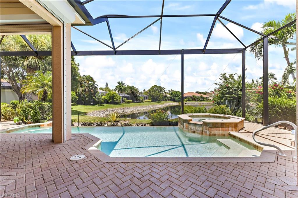 SIMPLY ELEGANT! This beautiful, highly desirable Martinique style home with nearly 2700 sq ft under air sits on a lush and spacious treed lot with a gorgeous pool and waterfall spa heated by solar panels on a nearly new roof. From the paved driveway, the paved deck, an outdoor kitchen, high dark color pool cage with panoramic screen and electric hurricane protection and a recently replaced air conditioner this home leaves nothing to desire.  Oh yes, it is also on a lake/pond with a water feature.  The chef's kitchen has stainless steel and is spacious with lots of cupboards.   The counter space is granite and includes a large bar area. The master suite is a dream, spacious with 2 walk- in closets with built in wood shelving and drawers, 2 separate vanities areas, a jetted roman tub and a walk-through shower.  Sterling Oaks offers many amenities like a heated Jr Olympic sized pool and spa, bocce, pickleball, a fitness center and a renowned optional tennis program, facility and tennis pro. Sterling Oaks is a gated community ideally located near world class beaches, shopping and easy access to RSW airport. 
Great opportunity.