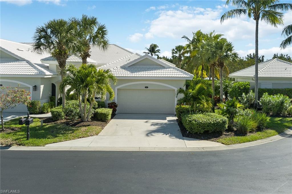 Welcome to this stunning end-unit villa with breathtaking lake views in Fiddler’s Creek’s Cardinal Cove community. This villa lives like a single-family home with no unit above or below and includes a new roof, new gutters, new hot water heater, large tile on the diagonal and crown molding throughout. The open kitchen is a chef's dream, offering ample white cabinetry, granite countertops and stainless steel appliances with a gas cooktop, perfect for preparing delicious meals. The master bedroom features two walk-in closets and an en suite with dual sinks, walk-in shower and separate soaking tub. Step outside onto your private lanai and take in the stunning views of the lake, perfect for enjoying your morning coffee or evening cocktail. This home offers a luxurious lifestyle with access to award-winning amenities, including full-service spa, sauna, fine and casual dining, and social activities. Keep up your active lifestyle with two championship golf courses, fitness center, tennis, pickleball, bocce ball, and a resort-style pool with waterfalls and slides. Golf, beach and marina memberships available. With its unbeatable location, this villa is the perfect place to call home.