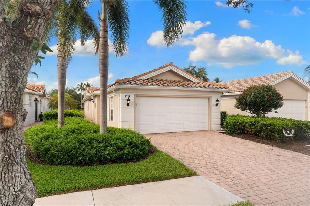 BRAND NEW ROOF June 2026! Welcome to 5338 Guadeloupe Way in the highly desirable community of Island Walk. Offered turnkey furnished, this beautifully maintained Extended Capri villa features 1,680 square feet under air, southern exposure, and a stunning wide lake view that can be enjoyed from the extended screened lanai.

Designed for comfortable Florida living, this light and bright residence offers an open floor plan, central vacuum system, and numerous recent updates that provide peace of mind for years to come. Major improvements include a brand-new roof and gutters installed in June 2026 with a transferable warranty, updated electrical, HVAC maintenance, fresh interior paint in the living room and primary bedroom, new lanai screening, and updated fan blades throughout.

The extended screened lanai creates the perfect space to enjoy morning coffee, entertain guests, or simply relax while taking in the tranquil water views and beautiful southern exposure.

Built in 1999 and meticulously cared for, this home is move-in ready and ideal as a full-time residence, seasonal retreat, or investment opportunity.

IslandWalk offers an unmatched resort lifestyle with an impressive list of amenities, including a resort-style pool, lap pool, fitness center, tennis courts, pickleball courts, bocce courts, putting green, clubhouse, and on-site dining. Residents also enjoy the convenience of a gas station, post office, beauty salon, and miles of scenic walking paths connected by charming bridges throughout the community. Spend your afternoons at the lakeside gazebo, stay active with endless recreational opportunities, or simply enjoy the vibrant social atmosphere that makes IslandWalk one of Naples' most sought-after communities.

Experience the best of Naples living in this exceptional lakefront villa.