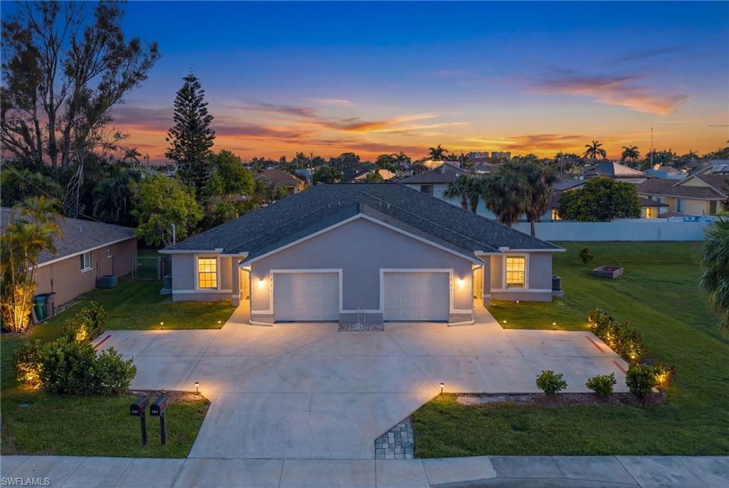 Now available for annual lease! Be the first to enjoy this beautifully maintained, nearly new 2023-built duplex located in one of the most desirable areas of SW Cape Coral. This spacious unit offers 3 bedrooms, 2 full bathrooms, and approximately 1,120 square feet of thoughtfully designed living space. The open-concept floor plan features tile flooring throughout, granite countertops, stainless steel appliances, and a bright, modern kitchen that flows seamlessly into the living and dining areas. The primary suite offers a private bathroom and generous closet space, while the oversized one-car garage and additional driveway parking provide added convenience. Enjoy desirable western exposure and your own private open-air patio, perfect for relaxing and taking in Southwest Florida's beautiful sunsets. One side of the duplex also features a fully fenced backyard, offering additional privacy and outdoor living space. Built in 2023, this home offers the peace of mind and energy efficiency of newer construction and is connected to city water and sewer. Conveniently located just minutes from shopping, dining, schools, parks, and everyday conveniences, with easy access to Fort Myers and all that Southwest Florida has to offer. This is an exceptional opportunity to lease a like-new home in a prime SW Cape Coral location. Schedule your private showing today!