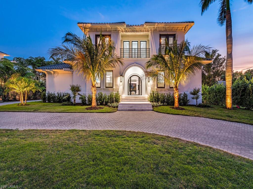 Built on beautiful Bahia Point west of Crayton Road this stately residence exudes coastal cottage charm after undergoing a tasteful and curated renovation. Completed in 2024 with new systems and equipment. The preferred southern exposure has the elevated pool and marble decking basking in the sun throughout the day with exceptional and rare back yard space. 5 bedrooms plus an office are spread out perfectly to allow privacy with access to two wet bar beverage centers and ice makers plus an indoor/outdoor loft on second level, as well as laundry on both floors. Elegant bespoke custom cabinetry designs showcase designer marbles and tiles, white quartz, and Wolf and Subzero appliances. Legno Bastone 10" wide white oak flooring. Kohler steam shower. Andersen impact low E windows offer peace of mind in any weather. Home was built 11.2’ well above the 10' required elevation.
