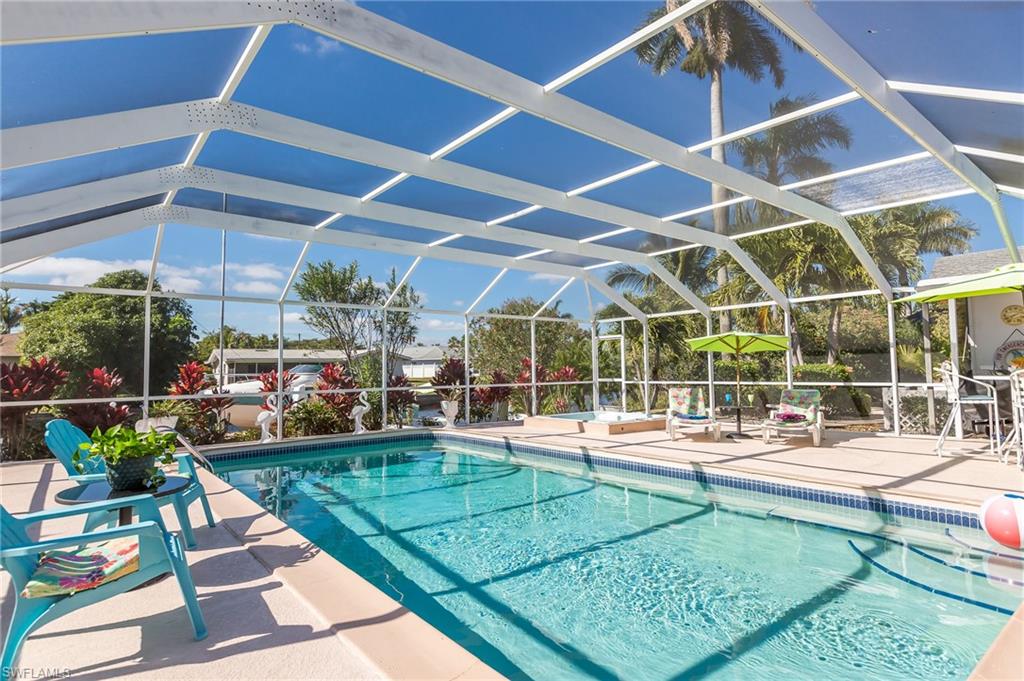 PRICE REDUCED $20,000! SELLER WANTS OFFERS! Beautiful Sailboat Gulf Access Home! Just five homes from your boat dock to the river! Enjoy breathtaking sunsets from the large western-exposure entertainment area with large heated pool and spa. Plenty of room for entertaining guests. Pull in to the circular drive and enter the home to an inviting, open and bright interior. Double sets of sliding doors provide tons of natural light and clear views to the lanai, pool and lushly landscaped grounds. Located in a quiet neighborhood of gulf access homes, it's a short walk or bike ride to Downtown Cape Coral's many shops, restaurants and watering holes, and a short drive to the Yacht Club beach. 
ALL ASSESSMENTS PAID. The home is periodically enjoyed by the owner, but it's primarily a very successful seasonal rental with over 300 rented days in 2018! Cha-ching! Please do not walk on property. Thank you!