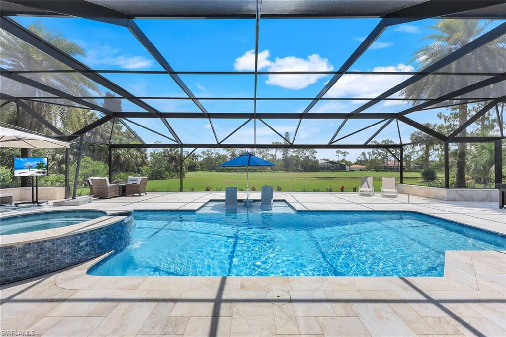 Welcome to 4701 Oak Leaf Drive, a stunning masterpiece located in the highly sought-after Quail Creek Estates in Naples. This elegant home has been completely reimagined with a 2024 remodel, showcasing high-end finishes and exquisite attention to detail throughout. Step inside to discover a bright and open floor plan with soaring ceilings and expansive slider doors and picture windows that flood the space with natural light. The gourmet kitchen is a chef’s dream, featuring premium appliances, custom cabinetry, and an oversized island perfect for entertaining. The primary suite is a true retreat, offering a spa-like bathroom with a large marble tile shower, dual vanities, and two custom spacious walk-in closets. The property also has all new impact windows and doors, all installed Oct 2024. Outdoor area is an entertainer's paradise, boasts plenty of space to enjoy the Florida lifestyle, situated on an oversized lot with lush landscaping, offering tons of privacy, complete with a new pool and spa, sand blasted marble patio, a new panoramic screen cage overlooking breathtaking views of the creek and 13th fairway and green of Quail course. Quail Creek is an exclusive community known for its world-class amenities, including two 18-hole championship golf courses, tennis courts, fitness facilities, and a vibrant social calendar. Conveniently located near top-rated schools, fine dining, and upscale shopping, this home offers the perfect blend of luxury and lifestyle.