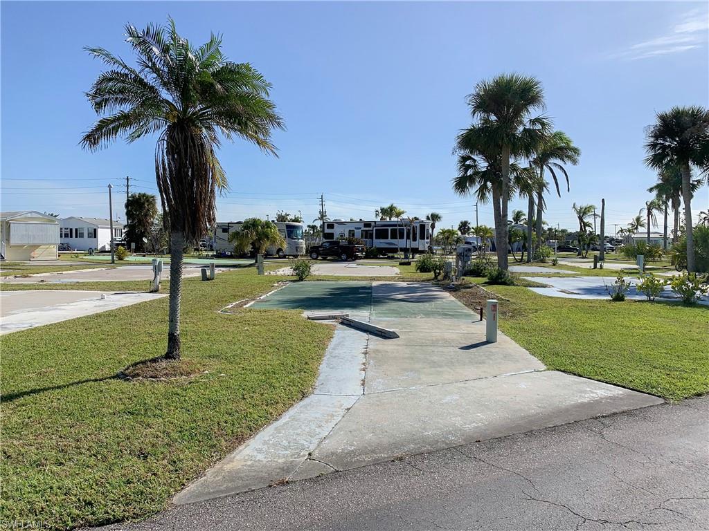 Your perfect Florida getaway starts here! This beautiful lot is located on a two-way street and can accommodate an ASHI tiny home, park model, camper, RV, or double wide manufactured home. Buyer is having the electric restored with water and sewer available. There are 5 sets of community showers and a large laundry room in the clubhouse. There’s so much to do in this community with just a short stroll to the amenities such as a large pool and clubhouse, tennis, shuffleboard, volleyball, pickleball, horseshoes, and a number of other community activities. This lot is located in the non-pet section and golf carts are welcome. The community is located just 3 miles from Times Square Fort Myers Beach, and just 1 mile from Bunche Beach on the Gulf where you can shell, rent kayaks, and watch amazing sunsets over Sanibel Island. Walk to shopping, restaurants, the beach, and more.