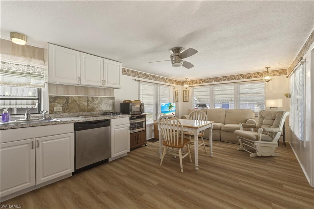 Welcome to the “BARTLETT COTTAGE”, THE DIAMOND OF MARINER’S COVE!! The best deal in the community! This spacious floor plan offers an expansive entry into a screened porch area, meander up a couple of steps to a cozy kitchen overlooking an expansive sun-filled great room and dining area.  This home offers brand new, upgraded laminate flooring throughout, and is fully furnished and ready for occupancy.  The home has been freshly painted, and ready for you to enjoy all the amenities that Mariners Cove has to offer.  Mariners Cove offers low monthly HOA and even includes water. NO HURRICANE IAN FLOODING! NO LAND LEASE FEES, all lots are individually owned. Mariners Cove has many amenities to include, a recently renovated lap pool with loungers on the river, community room with a full kitchen perfect for parties and community gatherings, shuffleboard, boat ramp with slips WITH GULF ACCESS, library and more! Mariners Cove is located just west of 41 and just minutes from beaches, coconut point, Bonita Springs, Miramar and Southwest FL airport!  Make Your Move!