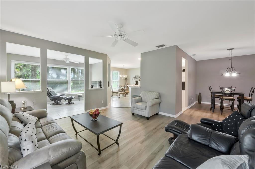 An exceptional opportunity awaits to create your ideal North Naples retreat in this rarely available first-floor end-unit residence, tucked within the intimate enclave of Charleston Square in Imperial Golf Estates. Offering 2 bedrooms, 2 baths, and 1,643 square feet of living space, the condo provides a bright, neutral canvas ready for the next owner to infuse with their own style and vision. The desirable end-unit location enhances the sense of openness throughout the interior, while the flowing floor plan easily accommodates both seasonal and year-round living. An enclosed porch extends the living space, offering additional flexibility for a sitting area, reading nook, or year-round enjoyment. A private enclosed garage adds convenience along with valuable storage space. Charleston Square is an intimate community comprised of just 37 residences, offering a peaceful setting with beautifully maintained grounds, walking paths, and a community pool. Perfectly positioned in North Naples, the location places you just minutes from the white-sand shores of Barefoot Beach, Vanderbilt Beach, and Delnor-Wiggins Pass State Park, with Mercato, Waterside Shops, and an abundance of shopping, dining, and entertainment destinations nearby. Residents also have the option to join Imperial Golf Club, offering access to premier golf, social memberships, and an array of private club amenities. Whether you're searching for a full-time residence, seasonal getaway, or investment opportunity, this property presents an exceptional combination of location, potential, and the coveted North Naples lifestyle.