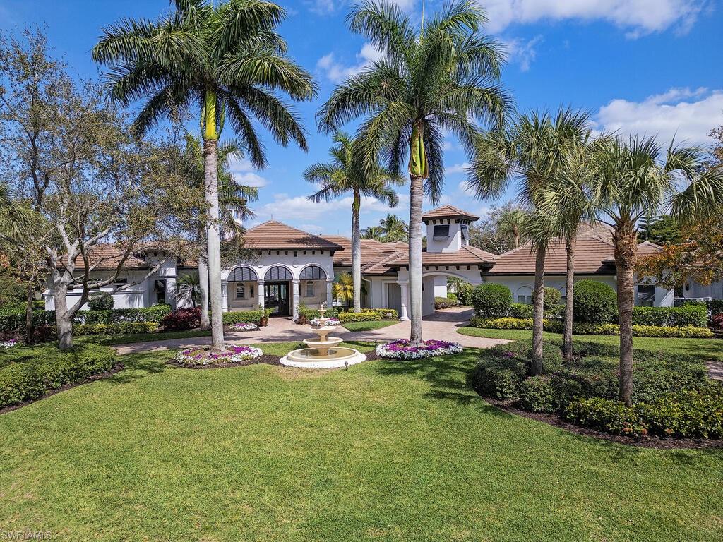 Stunning, fully renovated and furnished estate home in Tuscany Isle at The Colony Golf & Bay Club. No expense was spared in the recent complete reimagination of this iconic sprawling home on large corner lot. Features include new roof, whole house generator, unique wood and porcelain floors, reconfigured rooms, and an entirely new open kitchen and great room area worthy of any home magazine cover. Spanning 5,000 SF on one level, home includes 4 bedrooms, 4.5 baths, and air-conditioned 5-car garages. The opulent new owner suite with direct pool/spa access boasts entirely new bath with a floating tub, large shower and split dual vanities. Enjoy long, private lake views over the extravagant refurbished pool, fire bowls, and porcelain paver patio and lanai. Large, covered lanai can be enclosed by electric screens. A truly one-of-a-kind home that remained high and dry with no storm damage.  Living at The Colony grants access to the updated private waterfront Bay Club, featuring two levels of dining, and Pelican Landing's private 34-acre island beach park and pavilion. Fitness center and Kayak/Canoe Park also available.   Golf/Sports Memberships are optional at The Colony Golf and Bay Club..