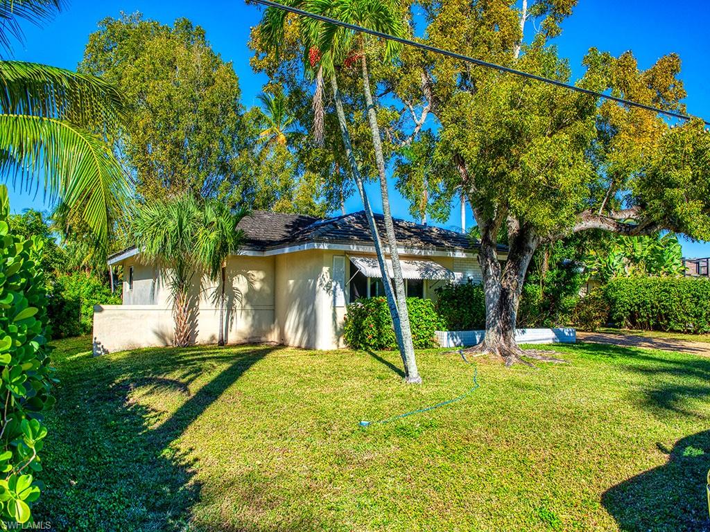 Situated on a deep water canal this property is being offered at land value and being sold As-Is with right to inspect. Renters occupying home until March 31, 2019, and no showings inside of home at this time. Survey available and may walk property with permission from Listing agents. Lovely property with gorgeous sunsets, a Boaters dream with direct gulf access and no bridges.