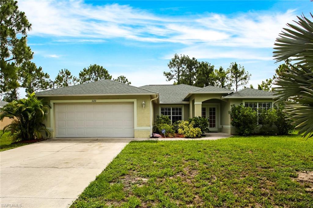 Great opportunity in Lehigh Acres. This gorgeous home is located only 8 minutes from I75 and only 4 minutes from Publix and convenient shopping! Plenty of space for a growing family at 2,139 Sqft with 4 bedrooms and 3 bathrooms. The open floor plan makes it great for entertaining and spending time with your loved ones. The split floor plan however still gives you privacy for you and your guest. With the nice summer days coming up you can enjoy your covered lanai and kids playground in the backyard. The home has also had the water system upgraded and has automatic sprinklers. Call today for your private showing of your next home with NO HOA FEES. Visit the video tour for a spectacular view of this property.