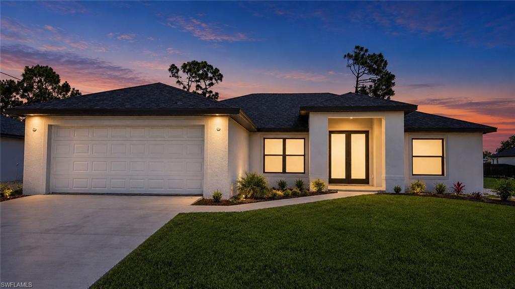NEW CONSTRUCTION!!Welcome to this beautifully crafted new construction home offering the perfect blend of modern design, quality craftsmanship, and everyday comfort. From the moment you arrive, you'll appreciate the hurricane-impact windows and doors, providing both security and peace of mind. Step inside to discover a bright, open-concept floor plan featuring porcelain tile flooring throughout and an abundance of natural light that enhances the home's spacious feel. The expansive kitchen serves as the heart of the home, showcasing tall cabinetry, sleek quartz countertops, stainless steel appliances, and a large center island ideal for entertaining or casual dining. The kitchen flows seamlessly into the living room area, where impressive four-panel sliding glass doors open to the screened lanai, creating an effortless indoor-outdoor living experience. Elegant tray ceilings in both the living room and primary suite add a touch of sophistication and architectural appeal. Designed with a desirable split-bedroom floor plan, this home offers privacy and functionality for both homeowners and guests. The spacious primary suite serves as a private retreat, featuring dual walk-in closets, separate vanities with quartz countertops, and a generously sized walk-in shower with a build-in bench seat. The guest bathroom is thoughtfully appointed with a stand-up shower, providing comfort and convenience for family and visitors alike. Ceiling fans in the primary bedroom, living room, and lanai provide year-round comfort, while the irrigation system helps maintain the landscaping with ease. Conveniently located just off Gunnery Road with quick access to SR-82 and I-75, this home offers an ideal location for commuters while remaining close to shopping, dining, schools, and everyday conveniences. Interior pictures are from a previously completed model, more pictures to come. Colors and fixtures may vary, and the floor plan may be reversed. Photos have been virtually staged using AI technology.