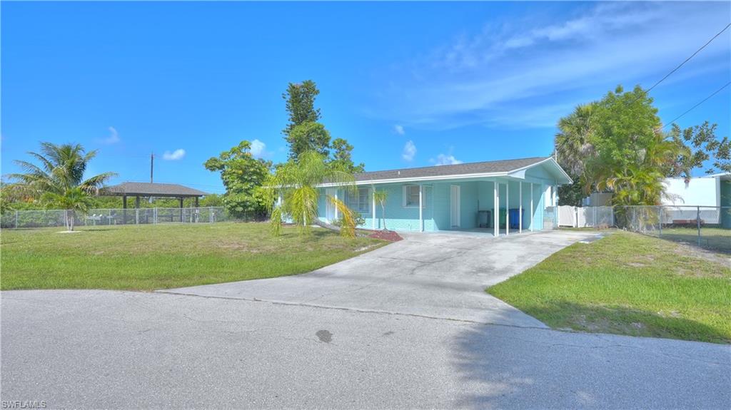 Very desirable triple lot location in Matlacha Isles. Over 220 ft of Seawall and 2 boat lifts, one with solid roof and Shingles. Home has newer Impact slider and hurricane rated accordion & rolldown coverings. Interior features matching tile throughout, Split bedrooms, one could be used as In-law Suite with separate bath & inertance. The lanai was converted to an additional bedroom giving you 4 total if needed. Kitchen updated in 2023 w/cabinets and counter tops, large pantry with washer & dryer inside. Roof replaced in 2023. This is truly a Fisherman's Dream home. Direct, No bridge access to anywhere in the world. Some of the best fishing anywhere is right in your back yard!!!
More Pictures coming Soon!!!