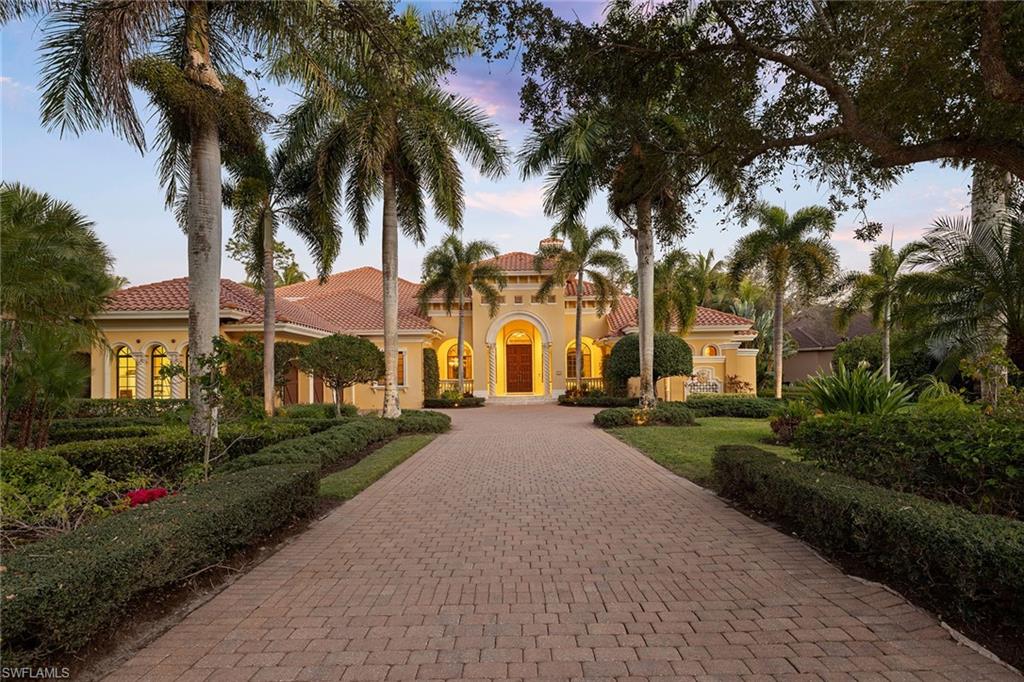 One or more photo(s) has been virtually staged, AI generated or rendered.  Set against sweeping southeastern views of water and preserve, this distinguished estate residence is thoughtfully designed for a life of elevated comfort and gracious entertaining. From the moment of arrival, the arched stained-wood entry door and transom windows introduce a sense of scale and architectural intention, while abundant natural light defines the home’s inviting interiors. Inside, stone floors and refined millwork guide you through expansive living spaces accented by coffered, tray and cove ceilings. Walls of glass, including zero-corner sliding doors and mitered windows, frame the landscape beyond, creating a seamless dialogue between indoor and outdoor living. Multiple fireplaces lend warmth and intimacy throughout the home, while custom built-ins add function and elegance. The kitchen serves as heart of the home, blending timeless finishes with professional-grade appliances, including a 48-inch paneled Sub-Zero refrigerator, gas cooktop, wall oven and custom hood. A generous island, walk-in pantry and thoughtfully designed wet bars on both levels ensure effortless entertaining, whether hosting intimate gatherings or larger celebrations. The primary suite offers a serene private retreat, complete with dual custom closets, a gracious sitting area with bay window, and a spa-inspired bath featuring multiple shower experiences, a soaking tub, bidet and tranquil fountain detail. Each additional bedroom is en suite, providing comfort and privacy for family and guests alike. Outdoor living is elevated to a resort experience, with a fireplace, outdoor kitchen, and a beautifully designed pool and spa featuring a gas heater, saltwater system and swim-up bar. A second-story balcony offers an additional vantage point from which to enjoy the surrounding views, while comprehensive storm protection provides peace of mind. A rare opportunity to experience architectural distinction, privacy and refined Florida living at its finest. In the prestigious Mediterra community, this exceptional residence offers access to world-class amenities and an uncompromising lifestyle in one of Naples sought-after settings. Enjoy your toes in the sand and golden sunsets at Mediterra's fully renovated private Beach Club along the Gulf. Imagine arriving to have your car valet-parked, and lounge chairs and umbrellas waiting for your arrival or set up upon your request. With 10,000 square feet of space, the upper level offers indoor and alfresco dining, a full bar, swimming pool along with lockers and dressing areas for changing. Spend the day and enjoy dinner while watching the sunset. Coming soon, the new Sports and Lifestyle Center. In the award-winning community of Mediterra, where you can have it all with 36 holes of Tom Fazio championship golf, Har-Tru tennis courts, pickleball, bocce and a private beach club! Some virtual photos included.