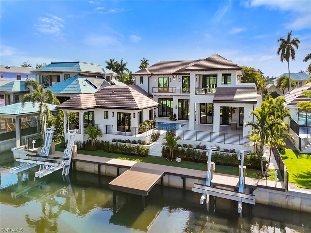 Welcome to 1707 3rd Street South, an extraordinary waterfront estate located in the prestigious Aqualane Shores neighborhood of Naples. Thoughtfully designed and masterfully built by Waterside Builders, this one-of-a-kind residence embodies the pinnacle of luxury coastal living.

Perfectly positioned along a tranquil deep-water canal with direct Gulf access, this boater’s paradise offers ample space for a yacht or multiple vessels while being just moments from the white sand beaches of Naples. Enjoy the convenience of walking to the renowned dining, shopping, and entertainment destinations of Third Street South and Fifth Avenue South.

Spanning over 7,400 square feet under air and more than 9,200 square feet under roof, this exceptional estate was designed for both elevated entertaining and comfortable everyday living. The residence features six spacious bedrooms, nine luxurious bathrooms, multiple indoor and outdoor entertainment areas, elevator access from the garage level, a fully deeded guest house, full catering kitchen, separate his-and-her offices, and expansive lounge spaces throughout.

The outdoor living experience is truly unmatched, highlighted by a resort-style oversized pool, expansive spa, private primary suite spa retreat, and beautifully designed gathering areas that seamlessly blend indoor and outdoor living.

Additional highlights include a dramatic custom staircase, extensive custom storage throughout the home, and impeccable craftsmanship at every turn.

1707 3rd Street South presents a rare opportunity to own a legacy waterfront property in one of Naples’ most sought-after locations. 

Private showings by appointment only.