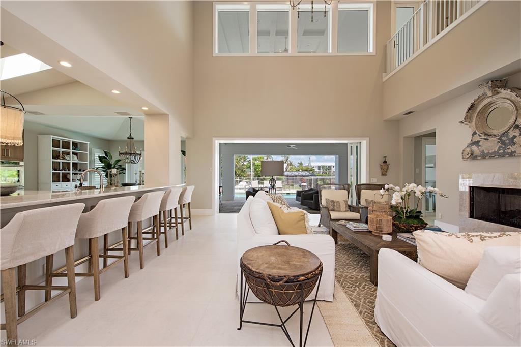 New Construction waterfront home on Crane Channel within Aqualane Shores offering Naples living at its finest with an 100 ft dock to dock your vessel, which includes direct Gulf access to the Gulf of Mexico. This 4 Bedroom, 4.5 bath home offers wood /Travertine floors over-sized heated pool/spa and large deck. Eat-in kitchen and formal dining room. Large 2nd floor covered balcony overlooking pool and canal. Two laundry rooms. Just a short .4 miles to the white sandy beaches Naples is known for or the World Class shopping and the fine cuisine restaurants on the world famous 3rd Ave S. Historic shopping district.