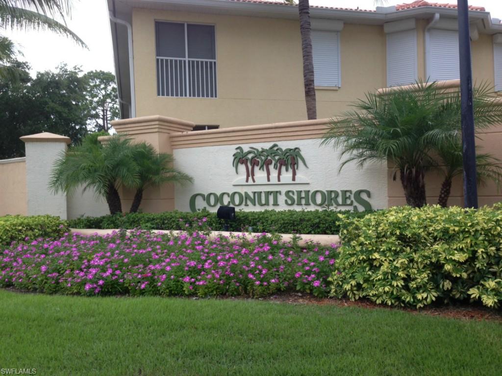 Downstairs end unit at beautiful Coconut Shores. Fantastic location! Better hurry these prices will be out of sight soon in this hot part of Estero.  Condo features 2 car garage, spacious kitchen, large lanai, master has tub and shower separate, plus guest bedroom and bath and a large den.  This well maintained gated  Community features white sandy beach, exercise room, large Chickee Hut for parties, resort style pool, and tennis.  Lush tropical landscaping! Seller has just reduced the price and is seeking reasonable offers.