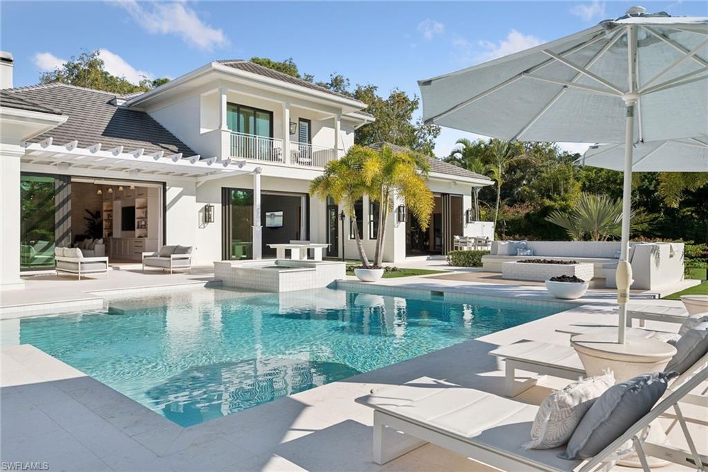 A statement in modern luxury, this estate combines thoughtful design, exceptional craftsmanship, and resort level amenities rarely found in residential living, including one of the area’s very few private pickleball courts. Positioned on 1.37 private acres with coveted southern exposure, it balances grand scale with warmth and everyday livability. Outdoor living unfolds as a private resort environment with nearly 4,000 square feet of additional outdoor space finished in premium maintenance free turf for year round enjoyment. The outdoor amenities include a custom 100 yard three hole golf course, private pickleball court, cold plunge, playground, pool, spa, outdoor kitchen and a beautifully designed fire pit for gathering and entertaining. A five car garage accommodates collectors or additional storage, and the fully fenced and gated property ensures exceptional privacy. Interiors are masterfully composed with bespoke cabinetry, layered materials, custom furnishings, and designer lighting throughout. No detail was overlooked. Soaring ceilings and abundant natural light enhance the interiors while framing tranquil views of the surrounding grounds, creating a seamless connection between indoor and outdoor living. The layout is equally suited to intimate daily living and large scale entertaining. Lifestyle driven indoor amenities include a fully custom movie room with a multi sport simulator designed for a variety of sports experiences, a professionally built out gym complete with cold plunge and outdoor showers, and an additional game room for family entertainment. 
Thoughtfully created as a one of a kind estate, this exceptional lifestyle property allows its new buyer to move in immediately and enjoy every amenity from day one, delivering effortless luxury living in the heart of Pine Ridge Estates, conveniently located just two miles to the beach and moments from the premier shopping and dining at Waterside Shops. A property of this scale and quality must be experienced firsthand to be truly be appreciated.