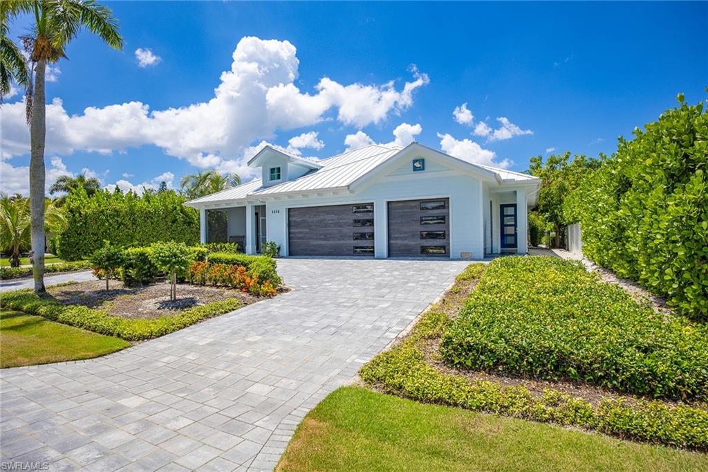*Discover Your Dream Vacation Home in Sun Terrace!** Located in the peaceful Sun Terrace neighborhood, this beautiful four-bedroom, 3.5-bath home blends modern elegance with coastal charm. Set on a quiet, non-through street and bathed in southern sunlight, it offers a serene retreat just a mile from the beach. Inside, you'll find a carefully designed interior that has never been lived in. The smart layout features two luxurious primary suites and two additional well-appointed bedrooms, providing comfort and privacy for everyone. The spacious open-concept living and dining areas are ideal for relaxing or entertaining guests, blending sophistication with coziness. Food lovers will enjoy two full kitchens, offering versatile options for hosting family and friends. Upgraded finishes include stylish tile, luxury vinyl plank flooring, and beautiful quartz countertops, all complemented by decor. Outside, your private oasis awaits! Swim in the pool and spa or relax on the large porch, perfect for outdoor gatherings and warm evenings. The spacious three-car garage provides plenty of storage for beach gear and recreational equipment. Outdoor enthusiasts will appreciate the proximity to Lowdermilk Park Beach (just a mile away), as well as to nearby Freedom Park, the Gordon River Greenway, and the Naples Zoo. Experience the ultimate vacation lifestyle in this stunning new home! You're just a short drive away from dining and shopping at the popular Venetian Village, downtown Naples, and the attractions on 5th Avenue and 3rd Street. Relax and enjoy the beautiful white sand beach a few miles away!
