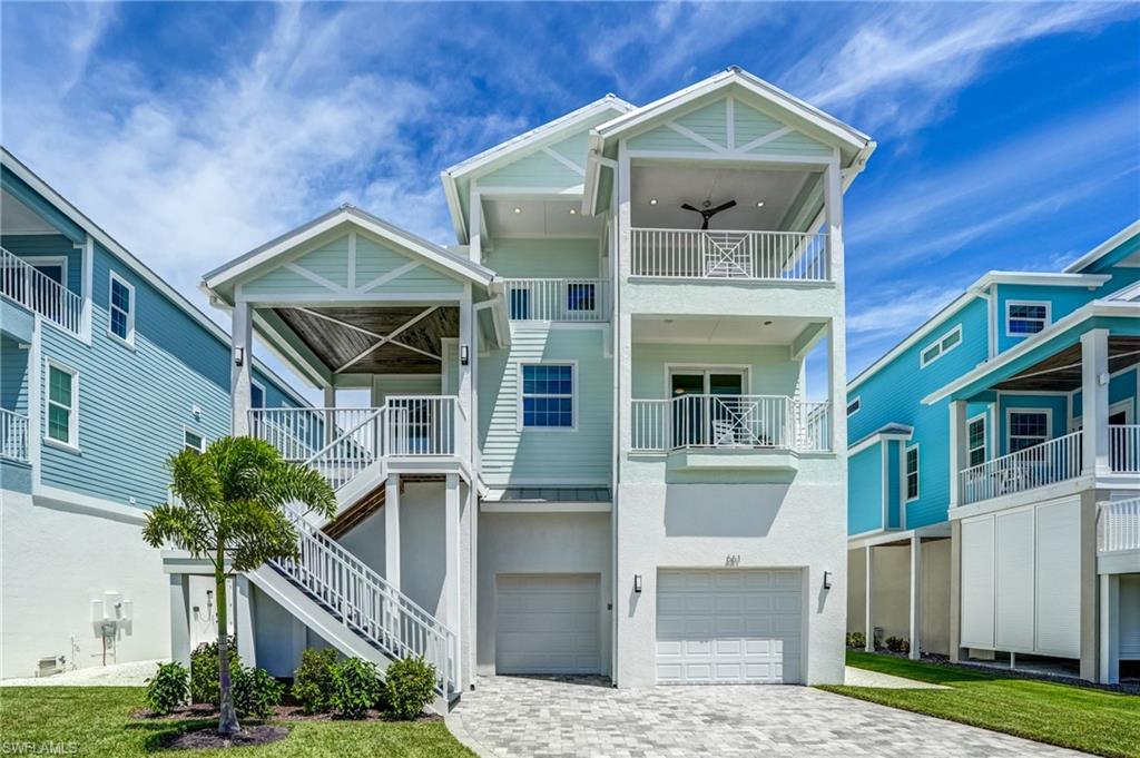 Stunning Beach-to-Bay View Canal Pool Home | 5 Bedrooms, 5 Baths. Experience the ultimate in coastal living with this newer Key West–style waterfront home, perfectly positioned across the street from the Gulf of Mexico and directly on a tranquil canal of Estero Bay. Offering breathtaking Gulf and bay views from every bedroom, this residence blends elegance, comfort, and convenience in one of Fort Myers Beach’s most desirable north-end locations—just a short stroll to Times Square. Step inside to discover 5 spacious bedrooms and 5 full bathrooms, including two master suites—one on each level. The first master retreat boasts a spa-like bath with a freestanding soaker tub and shower, while the second features a luxurious walk-in rainfall shower with dual shower heads. Each bedroom offers the privacy of an ensuite bath, ideal for hosting family and guests. Designed for both relaxation and entertaining, the home features two expansive family rooms, a well-equipped chef’s kitchen, two wet bars, and two laundry rooms. An elevator provides easy access to every level and a ground-level walkout. Outdoors, enjoy the saltwater pool and spa, complete with an outdoor kitchen and multiple balconies where you can soak in stunning sunrise and sunset views. This exceptional residence combines the best of beach and bay living—whether you’re watching the waves roll in from your balcony, entertaining poolside, or taking a short walk to restaurants, shops, and the iconic pier. A rare opportunity to own a true family-sized retreat in the heart of Fort Myers Beach.