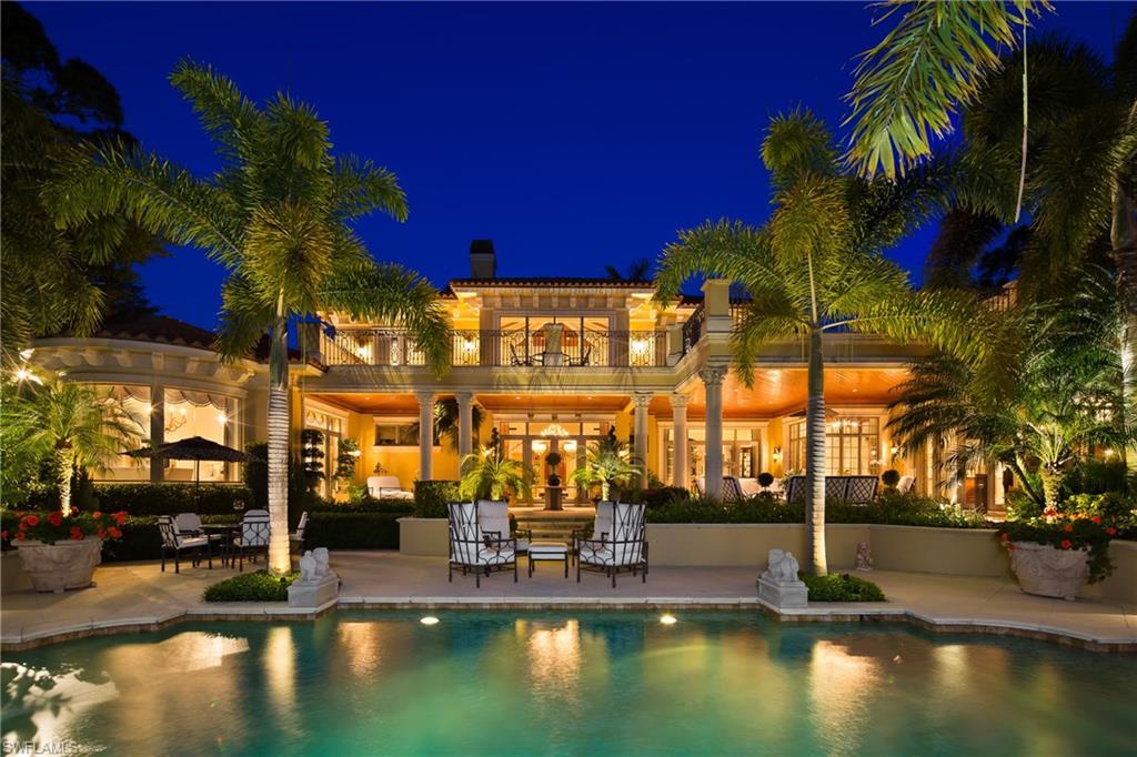 FULL GOLF MEMBERSHIP AVAILABILITY WITH THIS RESALE! NO WAIT LIST! An expansive motor court and impressive exterior architecture welcome you to this palatial two-story estate boasting sparkling lake and sweeping golf course views. The remarkable architecture of this estate is emphasized by a multitude of refined interior details including soaring ceilings highlighted by wide crown molding, tray, barrel and coffer elements, and stunning exposed wood beams. Meticulous designer touches throughout include recently updated custom furnishings, Corinthian columns, French doors, extensive windows, plantation shutters, lush carpet, and gorgeous stone flooring throughout the main living areas. Enjoy outdoor living at its finest in the incredible covered and open air outdoor living spaces highlighted by western exposure water color sunsets over the surrounding sparkling lake with sweeping golf course views beyond.