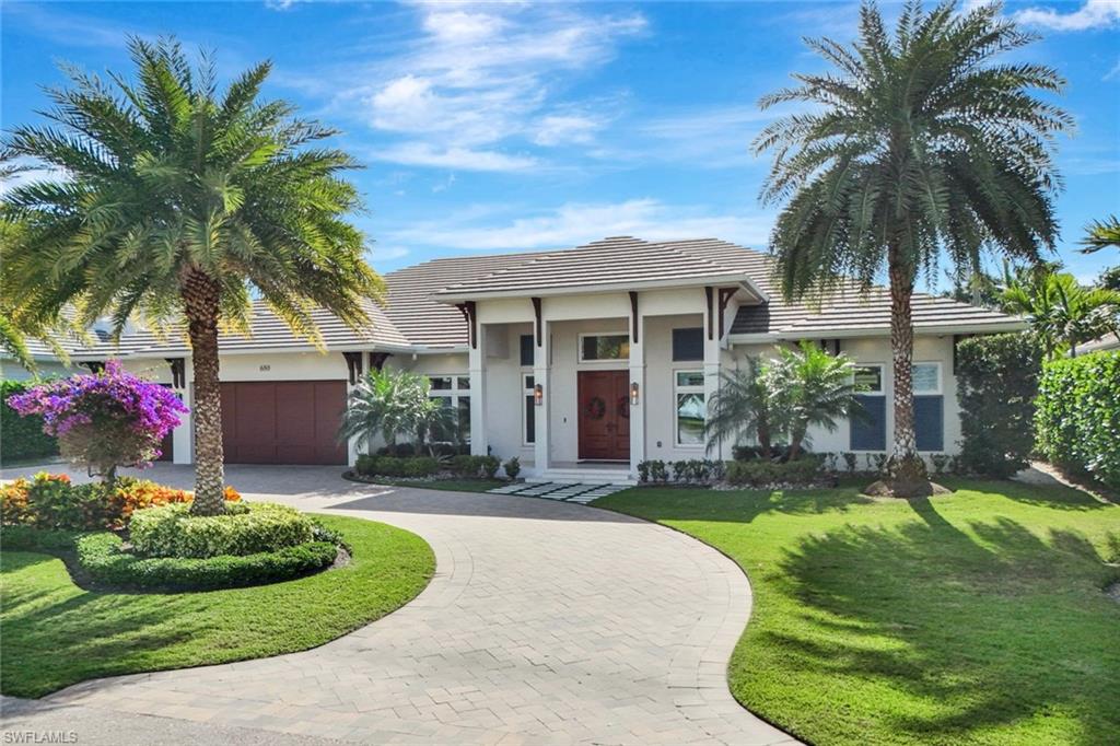 Discover the perfect blend of luxury and comfort in this stunning Naples residence, located just minutes from Moorings Private Beach Club and directly across from Moorings Country Club’s golf course. Nestled in the quiet Moorings neighborhood, you’ll enjoy effortless access to Naples’ most vibrant attractions on 5th Avenue South and Venetian Village.
Thoughtfully crafted by renowned builder BCB Homes for true indoor–outdoor living, the light-filled home opens with expansive sliding glass doors to a private resort setting—an inviting pool and spa, covered lanai, and a summer kitchen designed for year-round entertaining. Inside, the gourmet kitchen anchors the great room with premium custom cabinetry and millwork, European oak wood floors, and top-of-the-line Wolf and Sub-Zero appliances. Smart comforts include Lutron automated shades and multi-zone surround sound, enhancing everyday living and gatherings alike.
Retreat to a serene primary suite with a spa-style bath, while additional guest suites ensure privacy for family and visitors. The home includes two generous studies, window treatments and coverings, built-in closets throughout, and three garage spaces. Thoughtful details continue throughout—impact glass, beautiful finishes, and curated outdoor touches like a private outdoor shower and a large backyard. Located in an X Flood Zone for added peace of mind, this home is also eligible for a Moorings Private Beach Club access—a rare find.
Ideally situated for the Naples coastal lifestyle, this exceptional Moorings residence is move-in ready and presents a rare opportunity to own near the sand, dining, and boutique shopping that make Naples world-class.