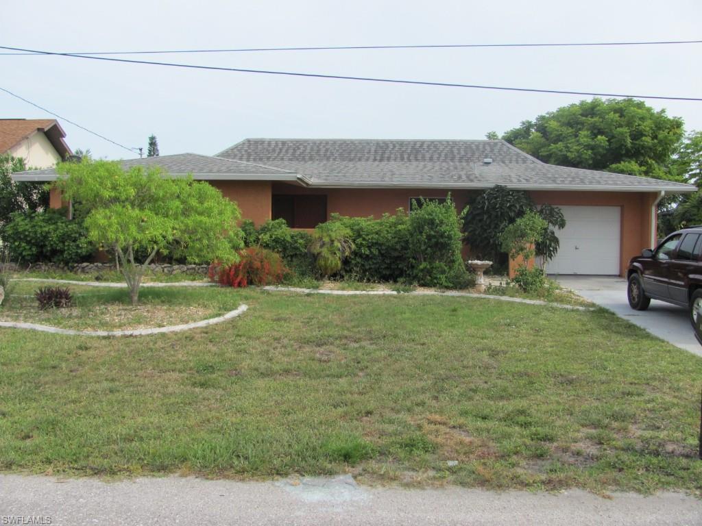 Beautiful Gulf Access Home! Bring your boat! This home is located on a gulf access canal with only one bridge to the river. This spacious 4 bedroom 3 bath home features tile in the living areas, an all-season sun room, a large open family room and updated kitchen. Located in desirable SE Cape Coral, this home is close to restaurants and shopping. It features 4 Bedrooms with 2 Master Suites (The 2nd Master Suite off of the Lanai has wall AC) * Large Backyard * Living Area includes enclosable Lanai that opens to Fresh Air and Al Fresco Dining too * Gulf Access - Only 1 Bridge To River * almost on the intersection of Orange Canal and Rubican Canal * Concrete Boat Dock with a Boat Lift * Tenants are in home on a month to month lease.