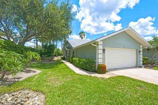 One or more photo(s) has been virtually staged, AI generated or rendered.  Your search for the perfect move-in ready Naples villa ends here—discover the rare combination of designer renovations, exceptional privacy, soaring vaulted ceilings, and an unbeatable location within one of Naples' most desirable amenity-rich communities. Tucked away on a private corner homesite, this beautifully updated 3-bedroom, 2-bath attached end-unit villa in Royal Villas at Crowne Pointe offers the feel of a single-family home with the convenience of maintenance-free living.

Flooded with natural light, the spacious open-concept floor plan is enhanced by dramatic vaulted ceilings, neutral designer finishes, fresh interior paint, and an effortless flow ideal for both everyday living and entertaining. The stunning chef-inspired kitchen has been completely reimagined with crisp white cabinetry, elegant stone countertops, stainless steel appliances, a generous pantry, and an oversized breakfast bar overlooking the expansive living and dining areas.

The luxurious primary suite serves as a peaceful retreat, featuring luxury vinyl plank flooring, abundant natural light, a custom walk-in closet with built-in organization, and a beautifully redesigned spa-inspired ensuite complete with dual vanities, designer lighting, modern black fixtures, and an oversized frameless glass walk-in shower finished with striking floor-to-ceiling tile. Two additional bedrooms offer flexibility for guests, a home office, or hobby space.

An oversized 8-foot sliding glass door opens to the private screened lanai, creating the perfect indoor-outdoor living experience surrounded by lush tropical landscaping and mature privacy hedges—ideal for morning coffee, evening cocktails, or simply enjoying Naples' year-round sunshine.

Residents of Crowne Pointe enjoy an exceptional resort-style lifestyle with a community clubhouse, resort pool, fitness center, tennis courts, pickleball, scenic lakes, walking paths, and a vibrant social calendar. Perfectly positioned just minutes from Downtown Naples, world-famous Fifth Avenue South, Naples Pier, pristine Gulf beaches, premier shopping, fine dining, golf, and endless entertainment, this home offers the ideal blend of luxury, convenience, and value.

Whether you're searching for a full-time residence, seasonal getaway, or investment opportunity, this impeccably updated villa is truly move-in ready and offers one of the best values currently available in beautiful Naples, Florida.