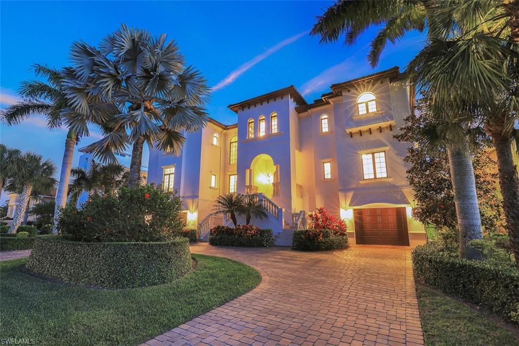 With a masterful design that showcases long majestic VIEWS OF VANDERBILT LAGOON and DIRECT GULF ACCESS, this meticulously constructed and maintained 3-story residence in Conners provides everything one needs for an incredible boating lifestyle.  It is evident the home is exceptional from fine details like custom mahogany double entry doors, architecturally designed ceilings, marble and hardwood flooring, a wood paneled elevator, stunning kitchen finishes, and a grand staircase with intricate wrought-iron railings.  At nearly 6,400 sqft of living area, and 11,500 total area, there are 5 en-suite bedrooms with 5 ½ baths, office, library, media room, and a 3-car garage.  Expansive terraces on all three levels provide amazing outdoor living space that overlooks the sparkling blue pool and spa as well as the private boat dock with 10,000 lb lift.  The home sets the standard for quality with poured concrete floors and walls, new AC, new hot water tanks, and new pool equipment. It also boasts an enviable location just a short walk from Vanderbilt Beach and a stone’s throw from upscale shopping, dining, and nightlife at Mercato, Pavilion, and the Ritz Carlton Resort!